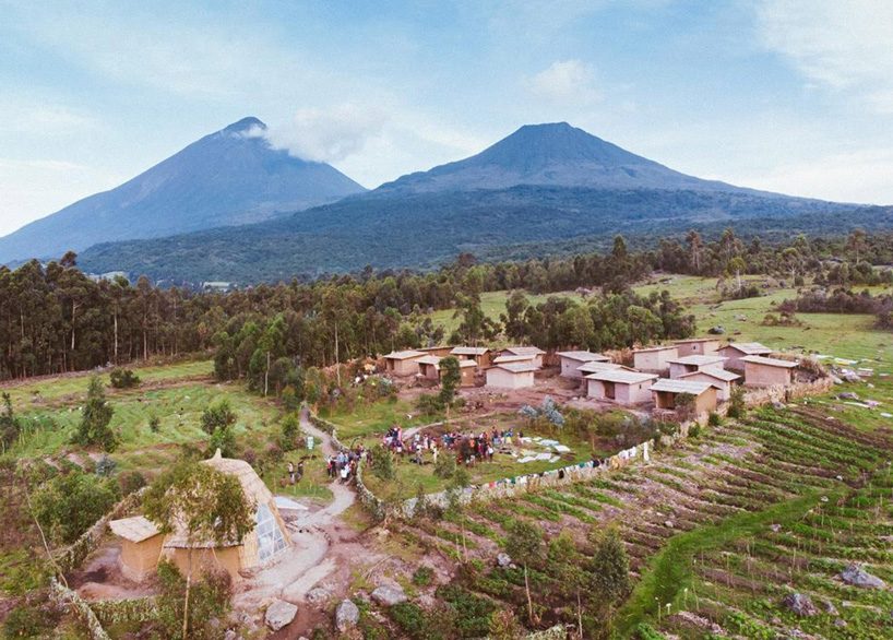 studio FH uses eucalyptus poles and rubble stone to build the batwa settlement in uganda