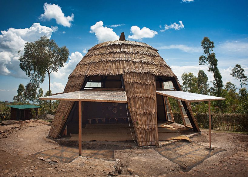 studio FH uses eucalyptus poles and rubble stone to build the batwa settlement in uganda