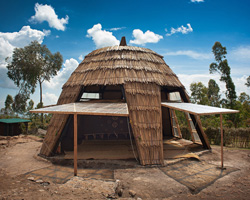 studio FH uses eucalyptus poles and rubble stone to build the batwa settlement in uganda
