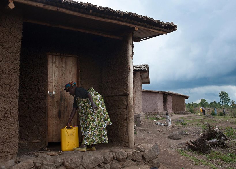 studio FH uses eucalyptus poles and rubble stone to build the batwa settlement in uganda