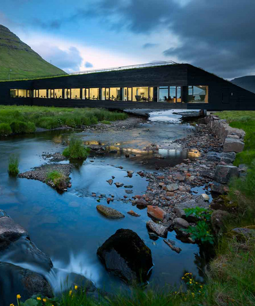 green-roofed town hall by henning larsen connects two communities in the faroe islands