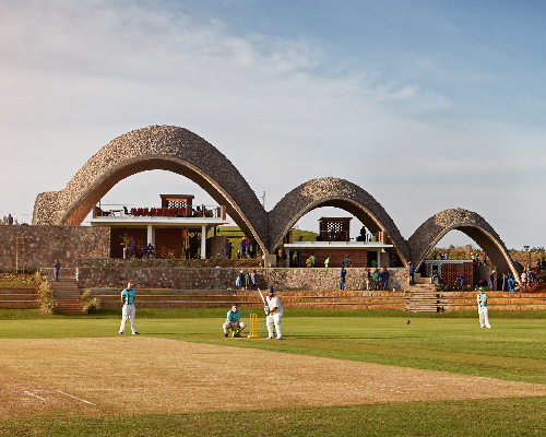 vaulted pavilion at rwanda cricket stadium mimics the movement of a bouncing ball