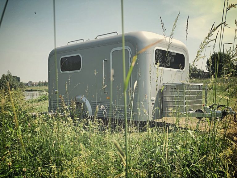 this aluminum camper comes with a panoramic open roof that lets you ...