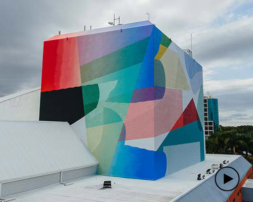 a bold multicolor mural you can see from the australian ocean, by MOMO