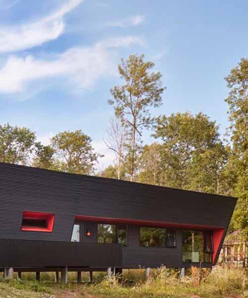thier + curran architects' retirement dwelling in ontario is clad in black corrugated metal