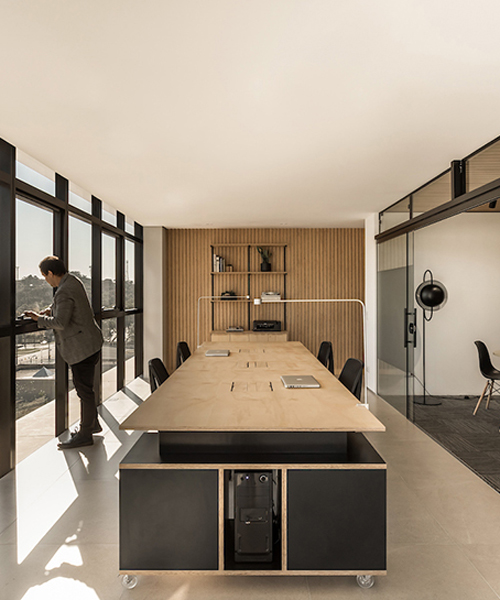 SOLO arquitetos sets an office with a panoramic view of the park in curitiba, southern brazil