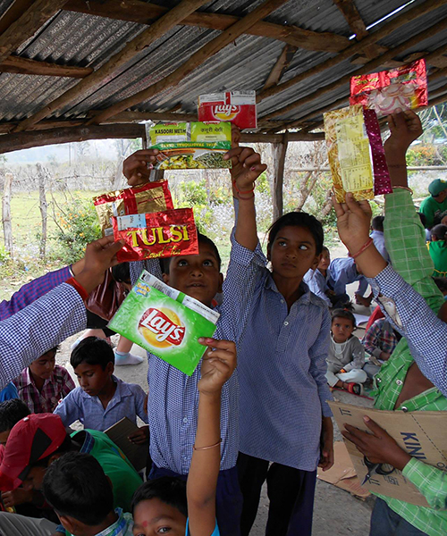 students in india fight plastic by sending back waste wrappers to manufacturers