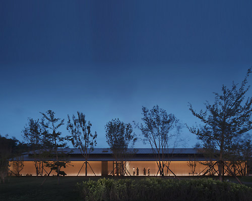 PLAT ASIA blends dining club with its nearby forest using glass walls and timber