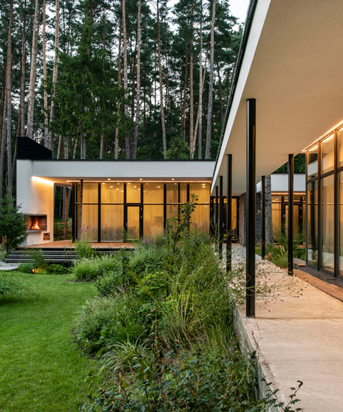 modernist house in lithuanian pine forest bridges a creek, by archLAB