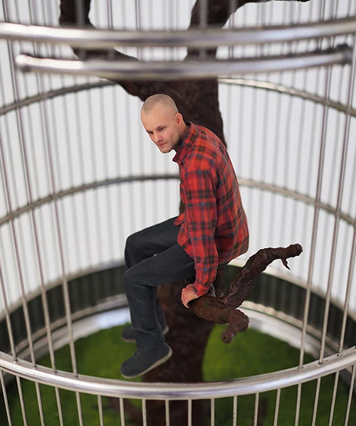 artist imprisons 3D printed 'mini-me' in birdcage to question contemporary ways of living