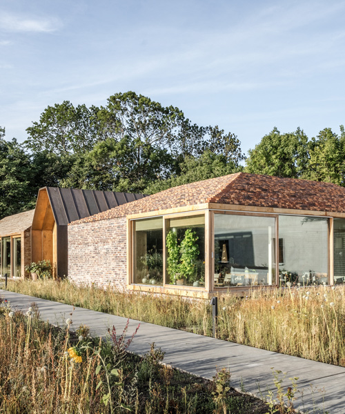BIG conceives an 'intimate garden village' for michelin-star restaurant in copenhagen