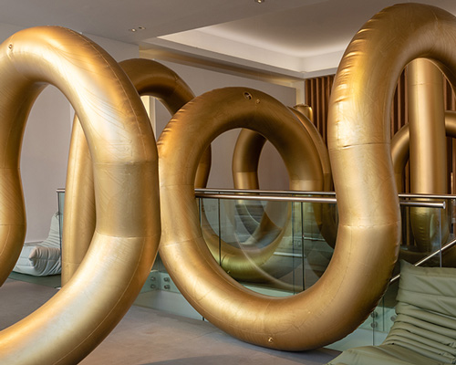 cyril lancelin fills ligne roset store with an inflatable maze of golden arches for LDF 2018