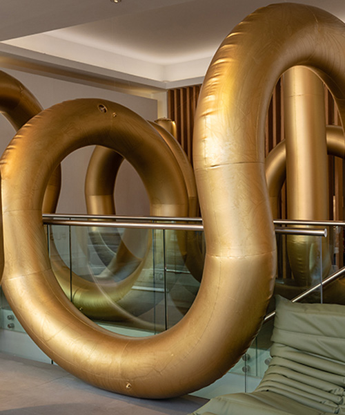 cyril lancelin fills ligne roset store with an inflatable maze of golden arches for LDF 2018