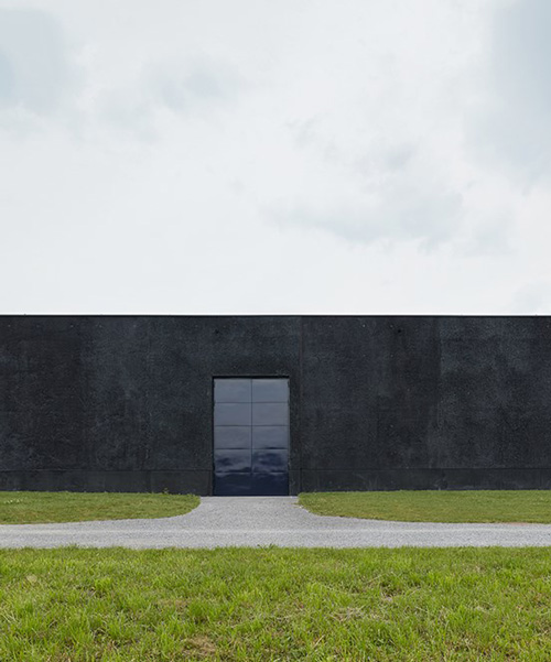 firm uses dark concrete and glimmering metal for groundwater pumping station in austria