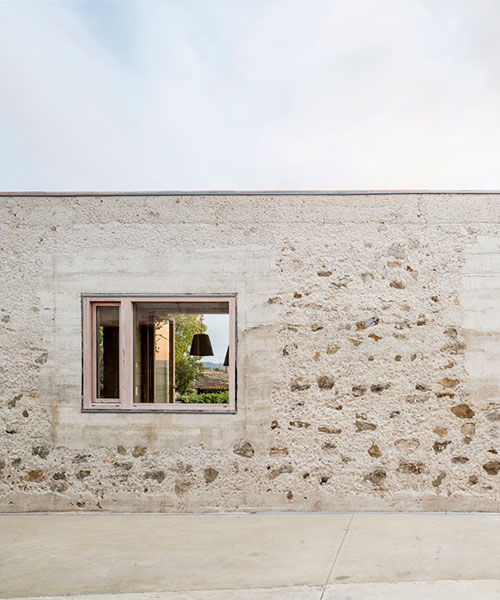 casa 1413 by HARQUITECTES emulates the ancient catalonia stone walls