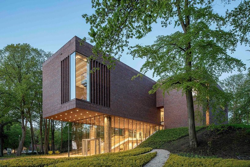 KVDK architects' lisse art museum sits on top of a historic dike in the netherlands