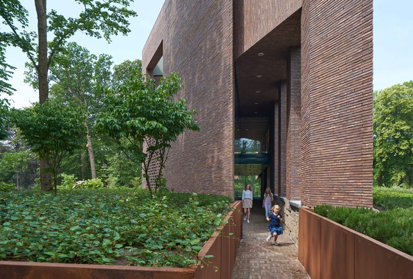 KVDK architects' lisse art museum sits on top of a historic dike in the netherlands