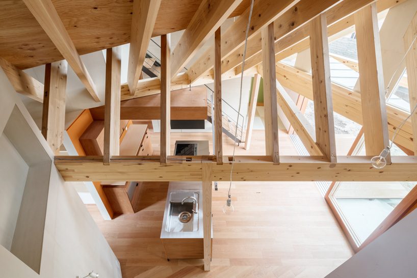 maki yoshimura frames two-volume house in japan with timber truss skeleton
