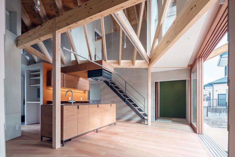maki yoshimura frames two-volume house in japan with timber truss skeleton