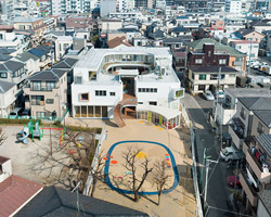 mamm design's kindergarten in tokyo concentrates around a lush green courtyard
