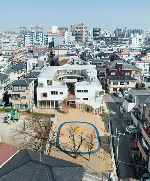 mamm design's kindergarten in tokyo concentrates around a lush green courtyard