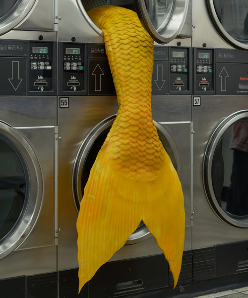 mermaid tails emerge from washing machines at a laundromat in LA