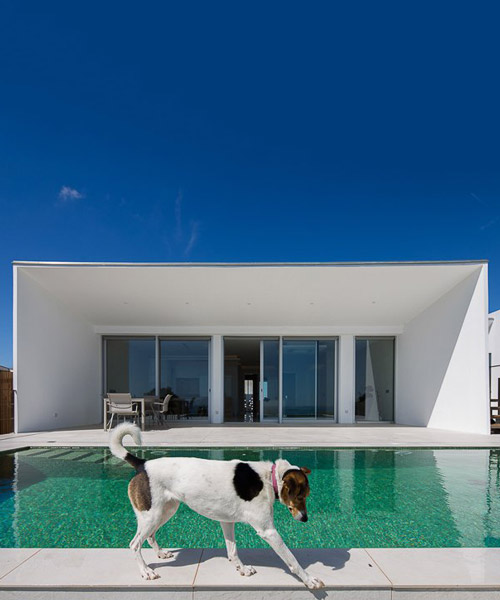 portuguese coast villa by CORE architects overlooks the ocean