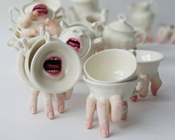 human body parts emerge from ronit baranga's hybrid ceramic tableware