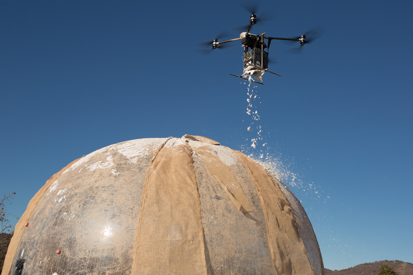 mud shell mud-spraying drones that build new homes could spell future for city housing