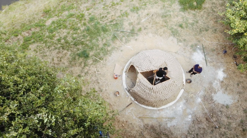 mud shell mud-spraying drones that build new homes could spell future for city housing