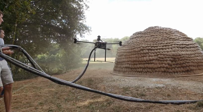 mud shell mud-spraying drones that build new homes could spell future for city housing