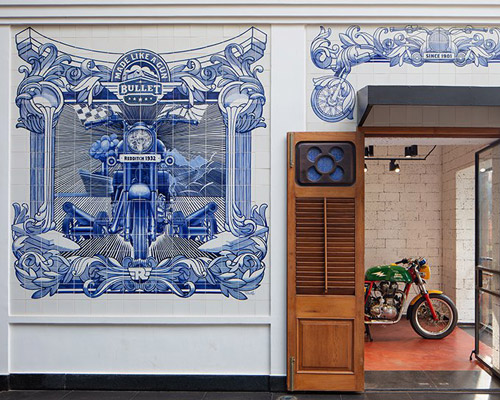 industrial style royal enfield garage cafe in goa is covered with portuguese hand-painted tiles, by studio lotus
