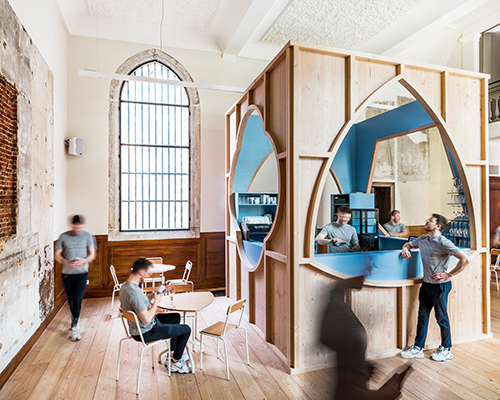 a contemporary gothic bar occupies belgium's largest cathedral