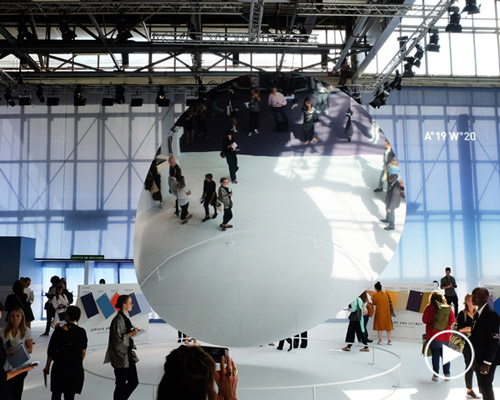 vincent leroy installs a reflective floating particle at premiere vision show in paris