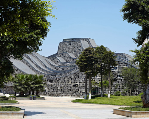 this sculptural hall in china mimics topography and movement