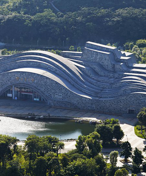 this sculptural hall in china mimics topography and movement
