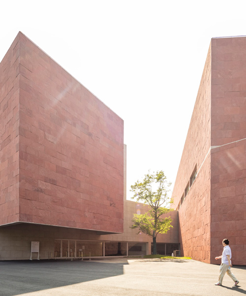álvaro siza and carlos castanheira wrap china design museum with red sandstone façades