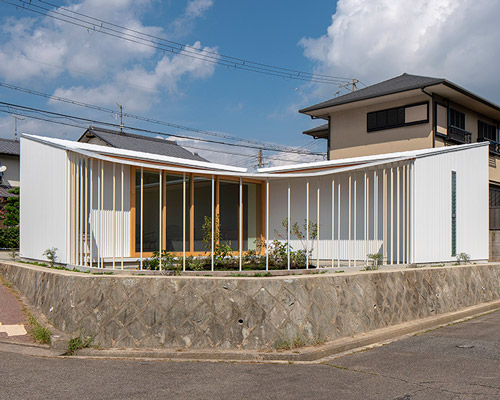arbol's family house in takarazuka is covered with corrugated aluminum