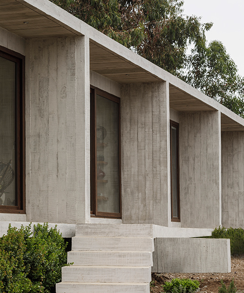 felipe assadi's concrete casa cipolla overlooks the rocky shoreline of a chilean lake
