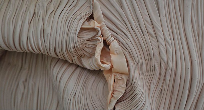 bart hess manipulates pink latex to resemble wrinkled human skin in grotto installation
