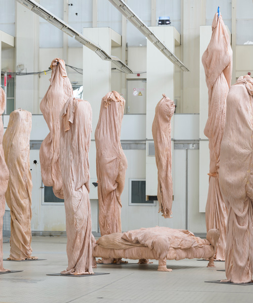 bart hess manipulates pink latex to resemble wrinkled human skin in grotto installation