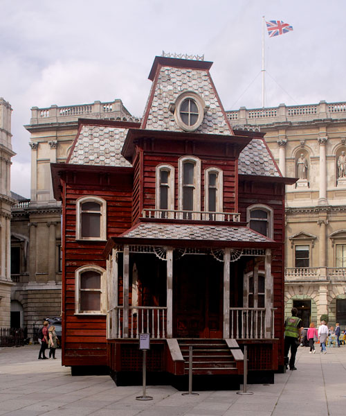 the sinister 'psychobarn' by cornelia parker takes up residence in london