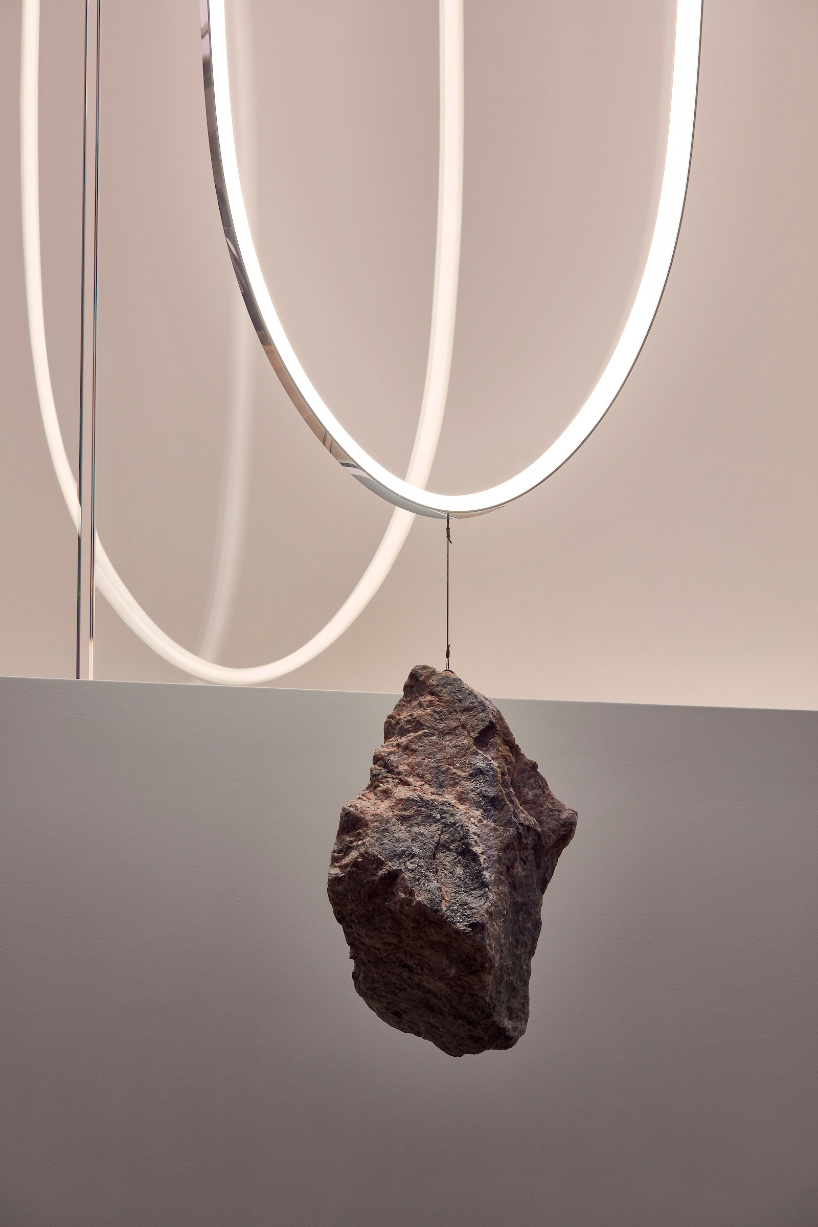 COS + paul cocksedge install gravity-shifting light artwork at coal drops yard store