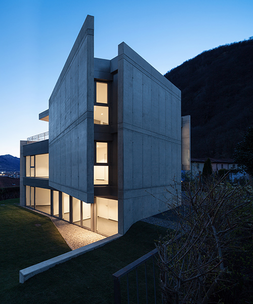swiss house XXXIV is a collection of shifted concrete planes within an alpine landscape