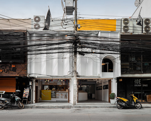 fattstudio renovates bento bar in bangkok with a perforated façade and hidden courtyard