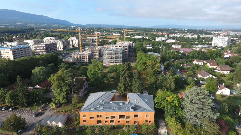 lacroix chessex architectes envelops the landscape with nursery in switzerland
