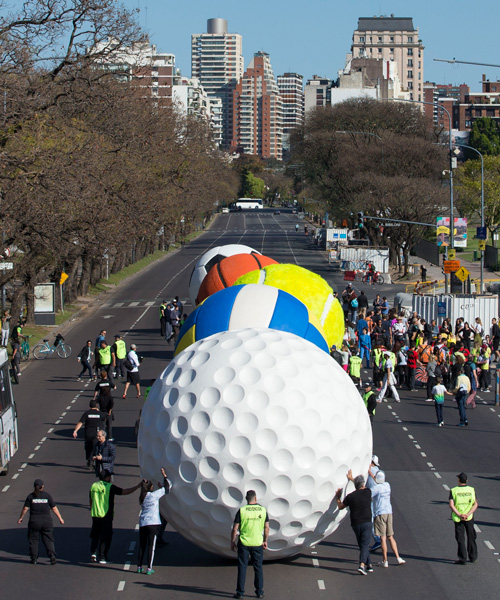 leandro erlich sets up playful, large-scale ball parade in buenos aires to celebrate olympism