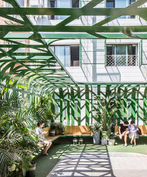 MAT office's courtyard in beijing is fenced by green steel canopy imitating trees
