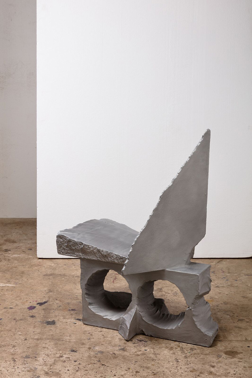 max lamb carves ‘prehistoric' objects from polystyrene then coats them with aluminum paint