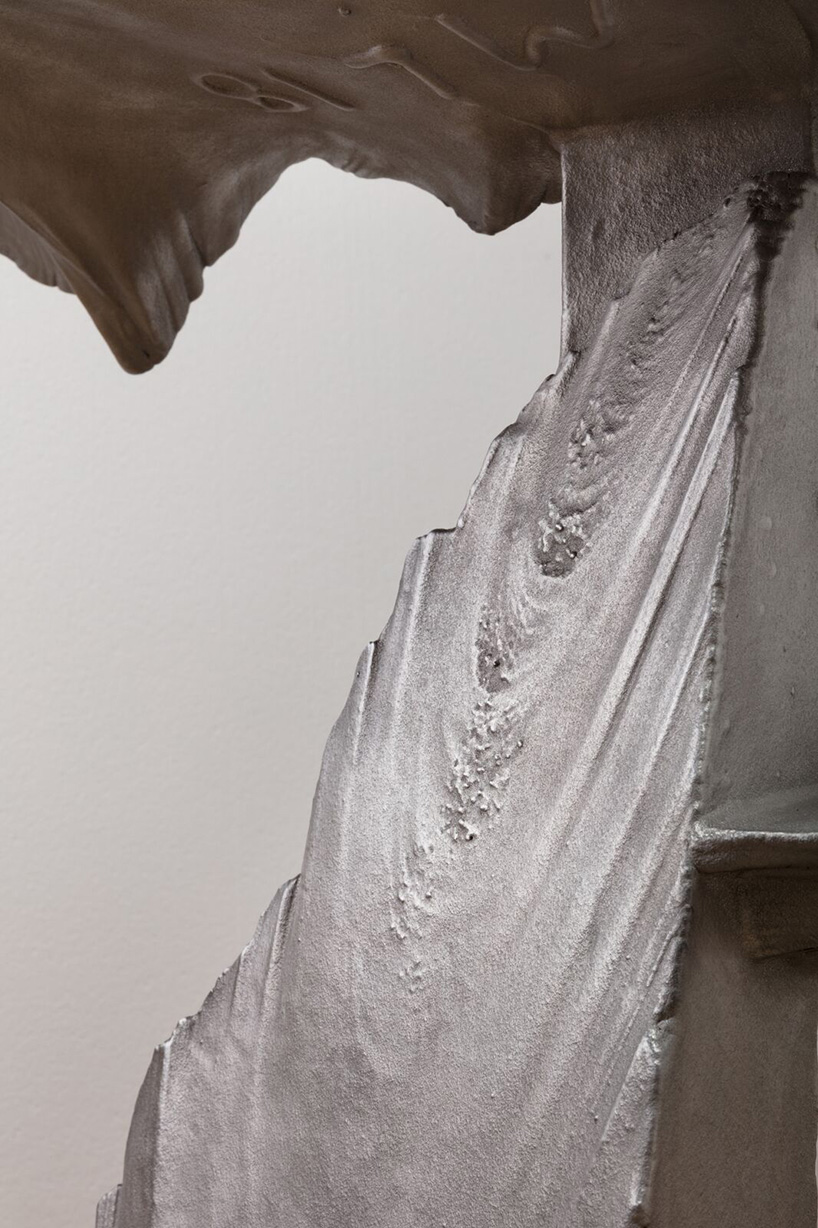 max lamb carves ‘prehistoric' objects from polystyrene then coats them with aluminum paint